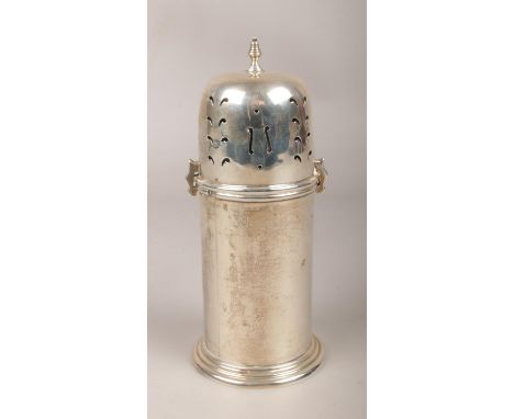A large silver shaker assayed Birmingham 1927, by Eldona Manufacturing Co Ltd. 181g. (Height approximately 17cm).  Dents to l
