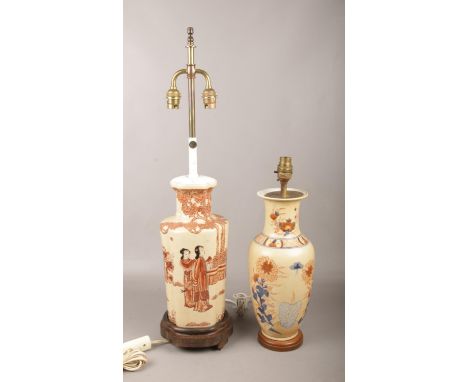 Two Oriental table lamps, one decorated with figures, the other with flowers.  Foot missing to one lamp.