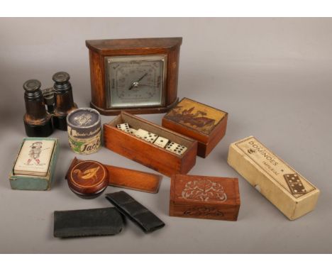 A box of collectables including oak barometer, binoculars, playing cards, dominoes, jacks in box and wooden trinket boxes etc