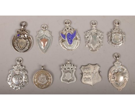 Ten silver medals and pendants to include football, enamelled examples etc, 77g.  