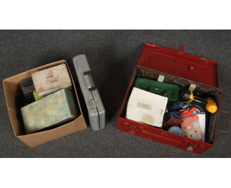 A metal ammunition crate and a box, both containing assorted tools.  