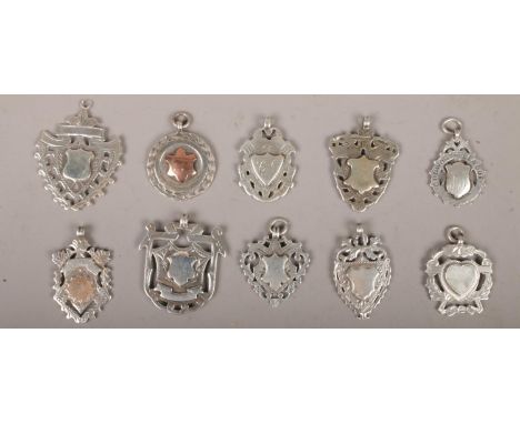 Ten silver pendants and medals.  