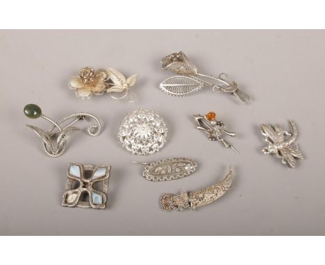 Nine silver and white metal brooches, to include filigree examples.  