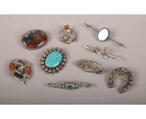 Nine silver and white metal brooches, to include Scottish examples.  
