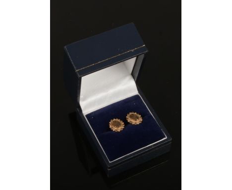 A pair of 9ct gold ear studs with engine turned engraving.  