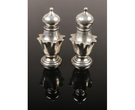 A pair of silver pepperettes, assayed London 1901. (41g).  