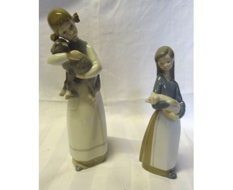 A Lladro figure of a girl holding a lamb, 8" (20cms) high and another of a girl holding a piglet.  (both boxed).