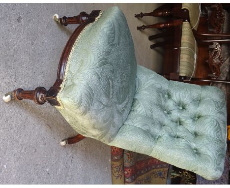 A Victorian low back Nursing Chair with button upholstered back and shape front seat on fluted turned supports. 