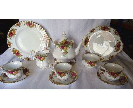 A Royal Albert Old Country Roses Table Service, comprising seven tea cups and saucers, nine tea plates, eight dessert bowls, 