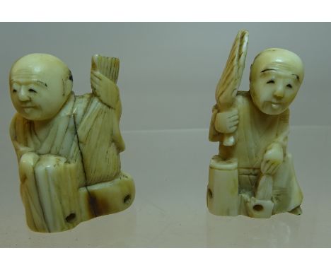 A late 19th Century Japanese carved ivory Netsuke in the form of a figure holding a fan and one other.