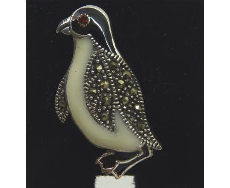 A silver enamel and marcasite Brooch in the form of a penguin.