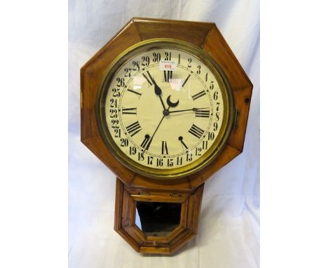 An American drop dial Wall Clock with white dial and alarm baring the paper label of Seth Thomas Clock Company in a pine case