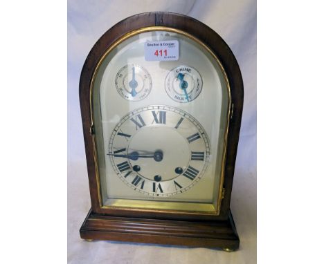 An early 20th Century Mantel Clock the steel dial with slow/fast and chime/silent rings with rod strike in a domed mahogany c