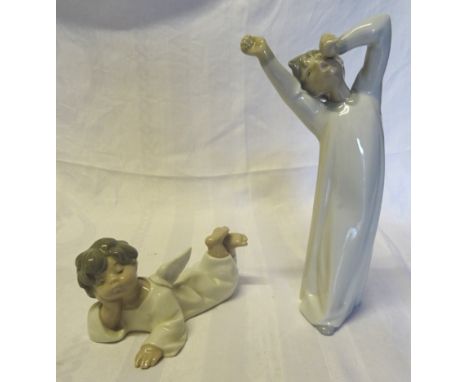 A Lladro figure of a yawning Child, 8 1/2" (23cms) high and another of an angel.  (both boxed).