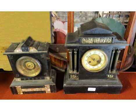 A Victorian Mantel Clock with ivorine dial in architectural black slate case with gilt metal mounts, 14" (35cms) high and a s