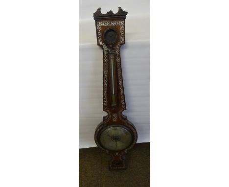 A 19th Century Wheel Barometer and Thermometer by Grassi & Rampoldi of Newcastle in a mother of pearl inlaid rosewood case.  