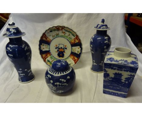 A pair of Oriental Prunus pattern baluster Vases and covers, a similar ginger jar and cover, Imari pattern plate and Ringtons