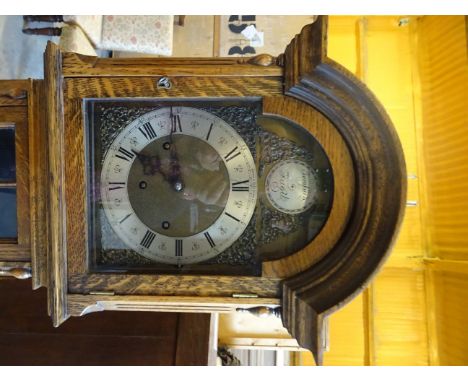 A Grandmother Clock, the steel and brass dial inscribed Mappin & Webb Ltd with gong strike in oak case with domed hood on bra