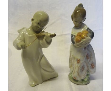 A Lladro figure of an Angel playing a violin and a Lladro figure of a child holding a basket of fruit.  (both boxed).