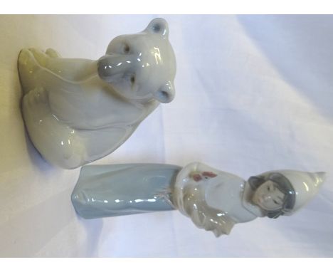 A Lladro model of a Polar Bear, 3 1/2" (9cms) high and a Lladro figure of a girl holding a hen, (boxed).