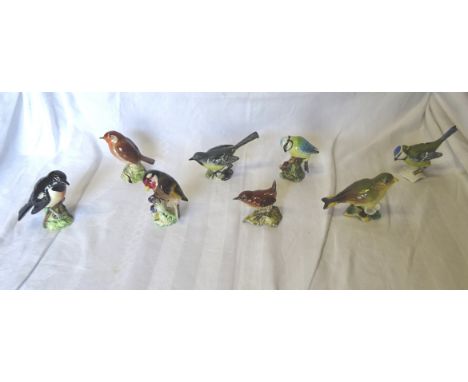 A Beswick Model of a goldfinch No.2273, a Beswick grey wagtail No.1041, five other Beswick birds and a Goebel bird ornament. 