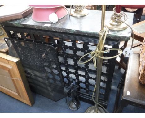 A WROUGHT-IRON RADIATOR COVER with portcullis design grill and green marble top, 37" wide, a fireguard and a set of fire iron