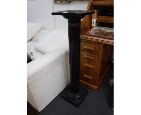 A VICTORIAN EBONISED FLUTED COLUMN STAND, 41" high 