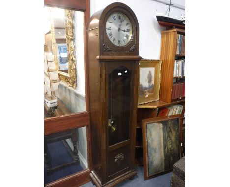 A 1930S OAK LONGCASE CLOCK with silvered dial, 76.5" high