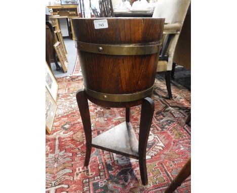 AN EARLY 20TH CENTURY BARREL FORM JARDINIERE with 'R A Lister & Co' label to the interior