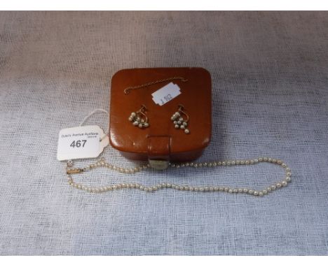A SEED PEARL NECKLACE, each graduated pearl knotted, terminating in unmarked yellow metal clasp, inlaid with three further se