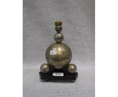 A CONTINENTAL WHITE METAL STAMPED '800' LAMP BASE, formed of balls on a triangular wood base, late 19th/early 20th century, 8