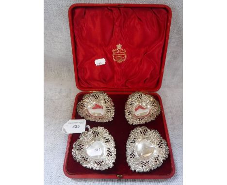 A SET OF FOUR HEART-SHAPED PIERCED DISHES, in a fitted 'The Alex R Clark Manufacturing Co, Fenchurch Street, London' presenta