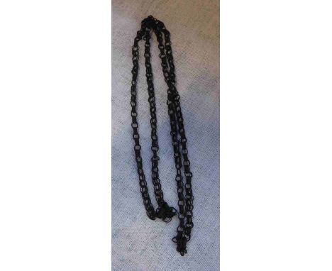A 19TH CENTURY BLACK HAIR MOURNING GUARD CHAIN with fine double links, woven in a single strand