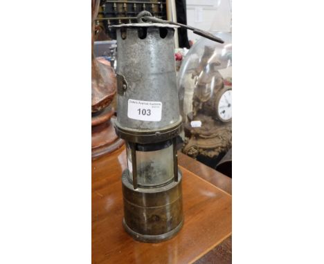 A VINTAGE MINER'S LAMP by 'J H Naylor Ltd Wigan'