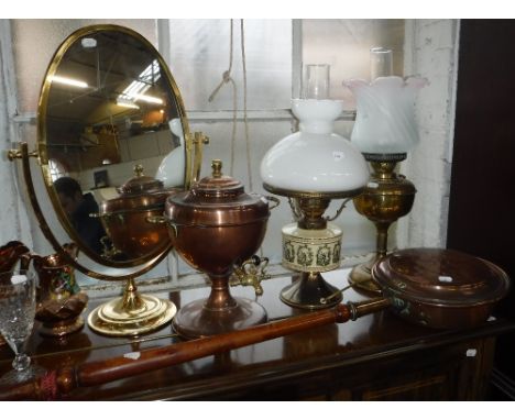 A BRASS FRAMED DRESSING MIRROR, an oil lamp and similar metalware
