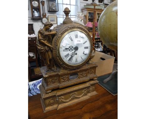 A CONTINENTAL GILTWOOD MANTEL CLOCK, the case of Barrie-form flanked by a figure in classical dress and an oil lamp, 10.5" hi