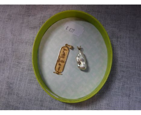 A MOTHER-OF-PEARL PENDANT set with a single brilliant-cut diamond, with a 14K yellow gold suspension and one other unmarked y