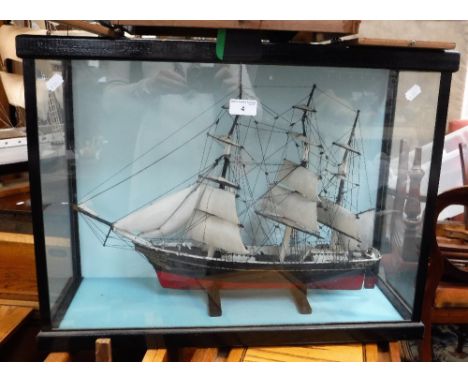 A SCRATCH BUILT OR KIT MODEL OF A SAILING SHIP at full sail with rigging 'Keepsake' contained in a glazed case, the case 18" 