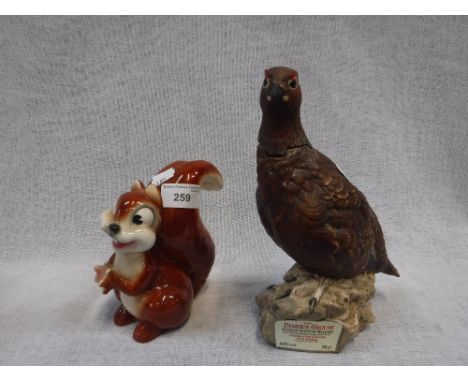 A 1930'S CHIP WALT DISNEY CERAMIC FIGURE and a Famous Grouse Scotch Whisky ceramic decanter (2)