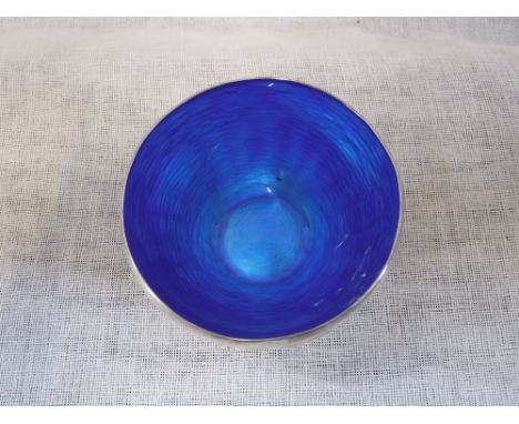 A HANDMADE SILVER BOWL, with blue enamel interior 'Handmade in Finland', 9cms dia.