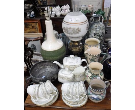 A ROYAL DOULTON 'PAISLEY' TEASET,  a Studio Pottery table lamp, similar ceramics, a brass oil lamp and a pewter bowl