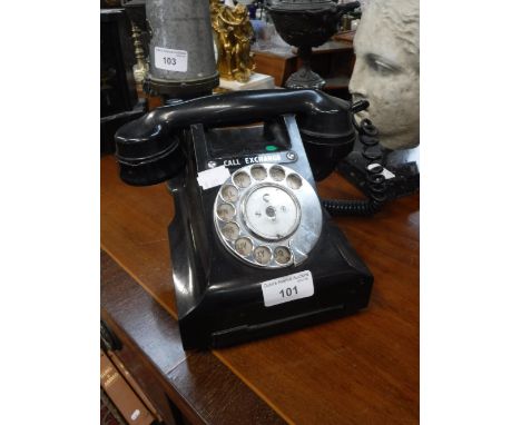 A VINTAGE BLACK BAKELITE TELEPHONE