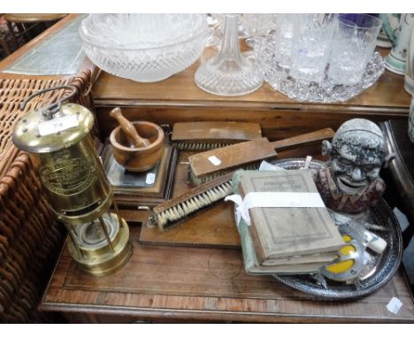 A BRASS MINER'S LAMP, a Black Boy money box and sundries