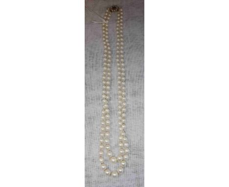 A SINGLE STRAND SIMULATED PEARL NECKLACE, terminating in a 9ct yellow gold clasp, set with pearls and gemstones, circa 57cms 