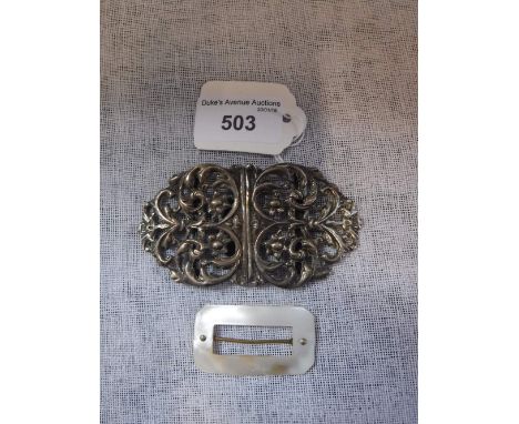 A SILVER NURSES BUCKLE and one other mother-of-pearl buckle (2)