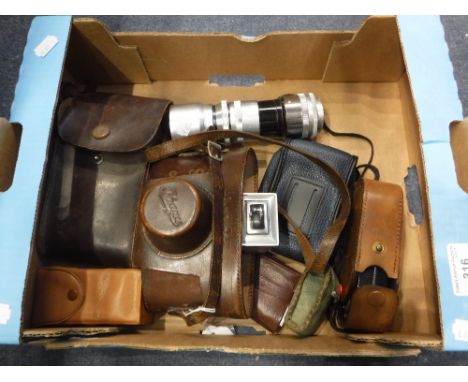 AN EXAKTA CAMERA with lenses and other camera accessories (one box)