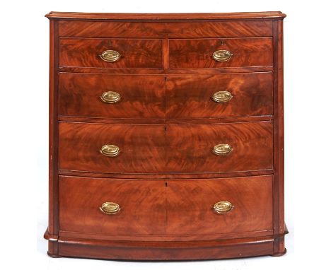 A Victorian figured mahogany bow fronted chest of drawers, c1880, the top with moulded lip above shallow frieze, fitted two s
