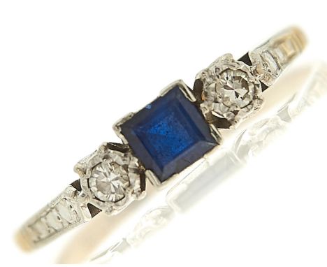 A sapphire and diamond ring, the step cut sapphire approximately 4 x 4mm, flanked by illusion set diamonds,&nbsp;gold hoop ma