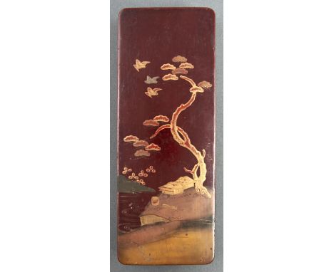 A Japanese lacquer box and cover, early 20th c, the cover decorated with finches, tree and buildings on a maroon ground, 24cm
