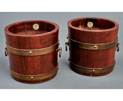 A pair of brass bound oak jardinieres, R A Lister &amp; Co Limited, Dursley, c1920, of staved construction with brass ring ha